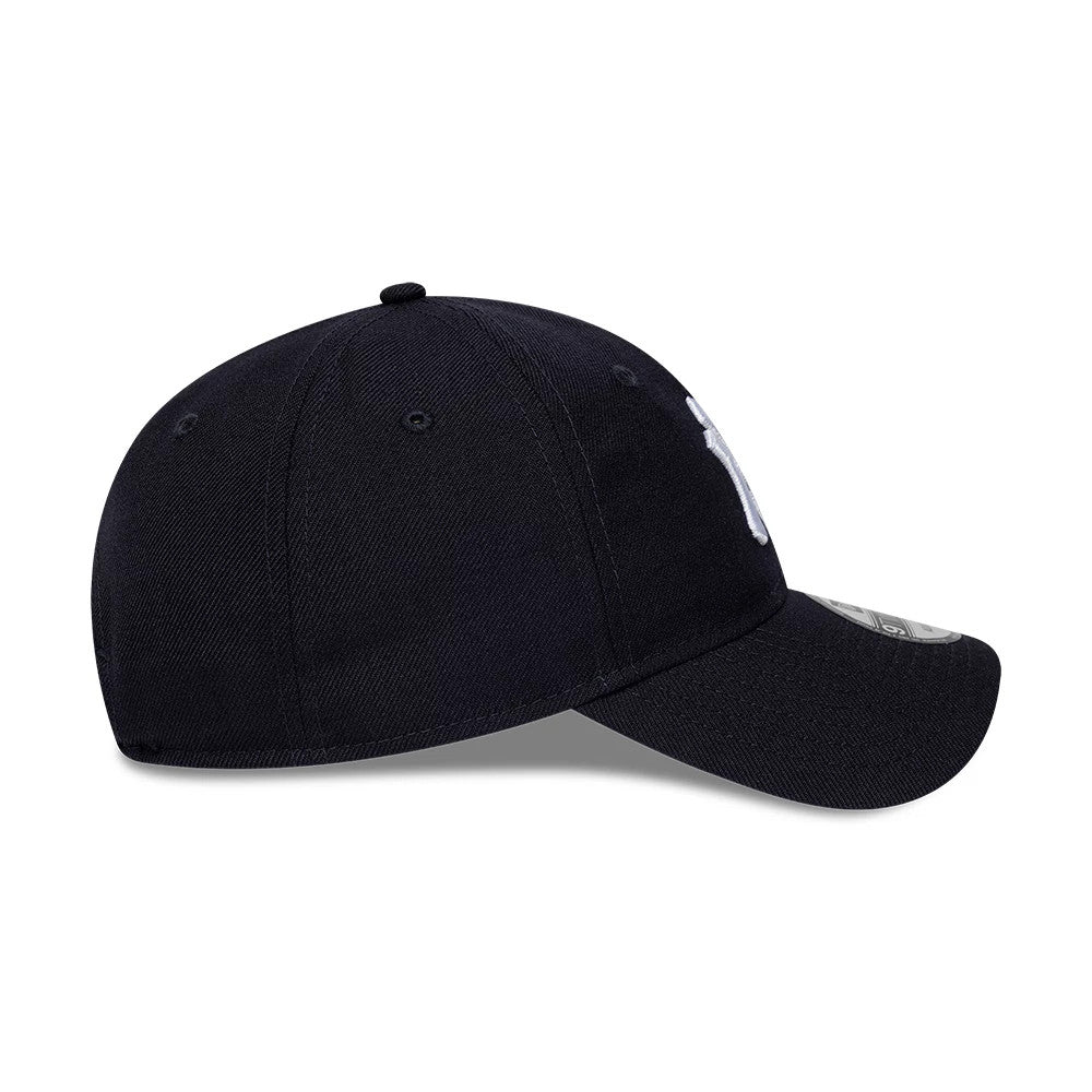 New York Yankees MLB Wool Navy New Era 9TWENTY Adjustable Cap, side view showing the curved visor, white Yankees logo embroidered on the front panel, and 9TWENTY size sticker on the visor.
