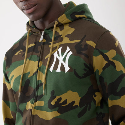 The model is wearing this MLB Camo New York Yankees 2 Way Full Zip Hoodie in Woodland Camo. 3