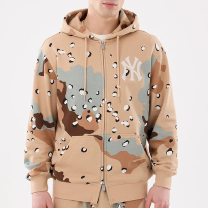 The model is wearing this MLB Camo New York Yankees 2 Way Full Zip Hoodie in Desert Camo. 3