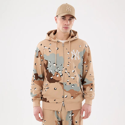 The model is wearing this MLB Camo New York Yankees 2 Way Full Zip Hoodie in Desert Camo. 1