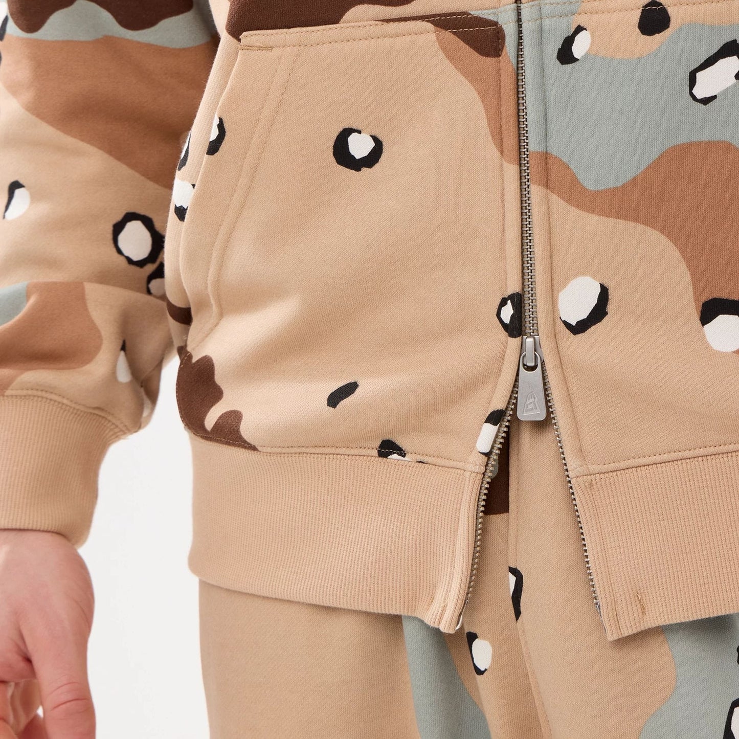 The model is wearing this MLB Camo New York Yankees 2 Way Full Zip Hoodie in Desert Camo. 6