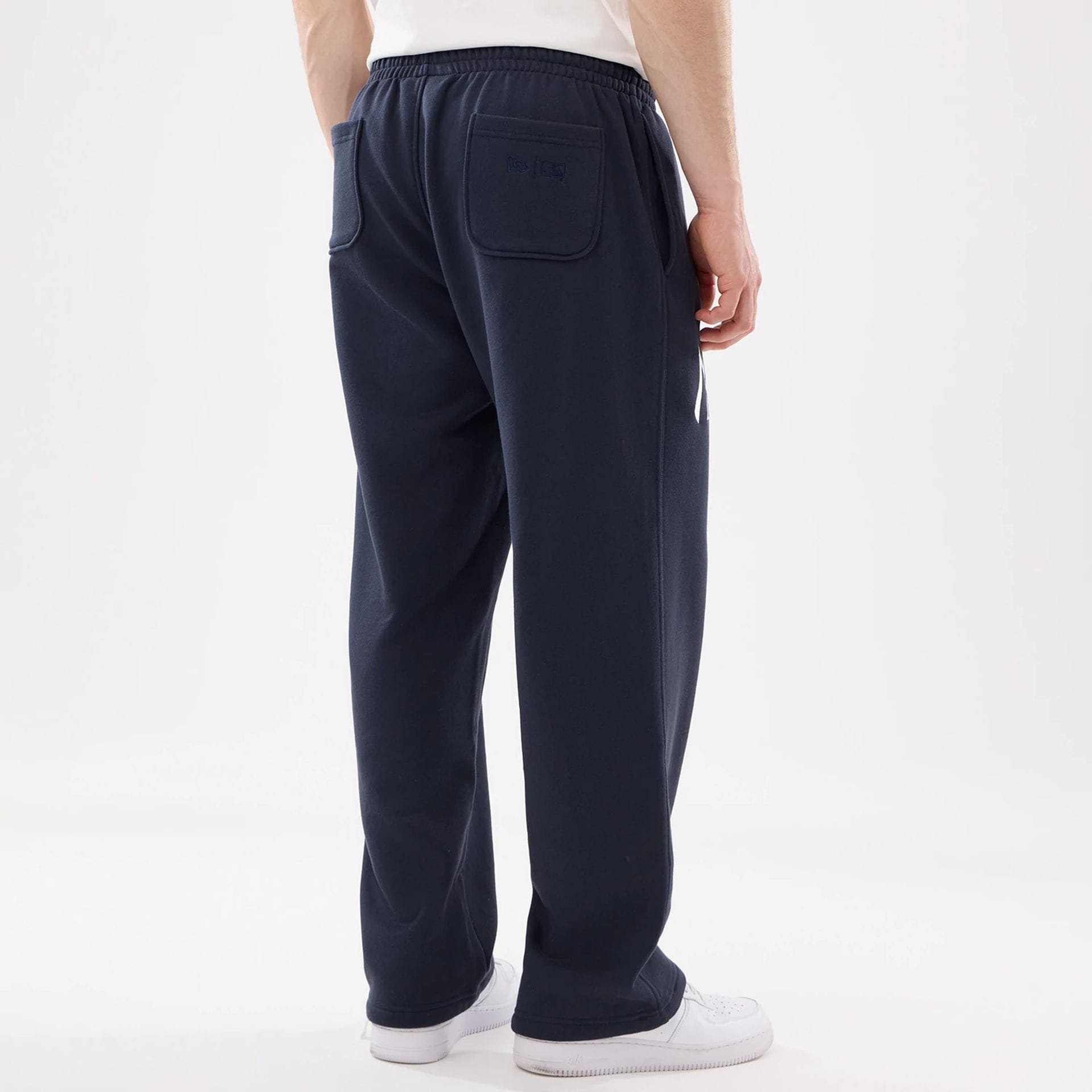 The model is wearing this MLB Comfort New York Yankees Joggers in blue. 2
