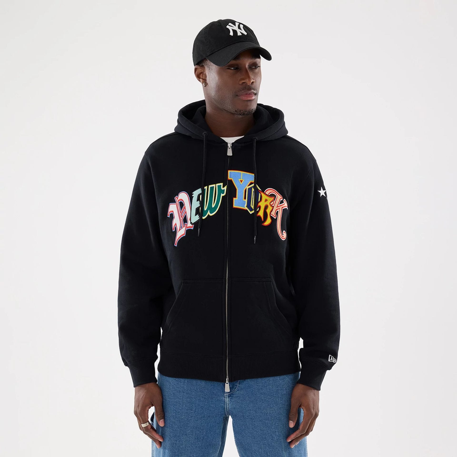The model is wearing this MLB Word Art New York Yankees 2 Way Full Zip Hoodie in black. 1