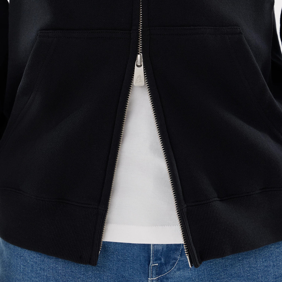 The model is wearing this MLB Word Art New York Yankees 2 Way Full Zip Hoodie in black. 6
