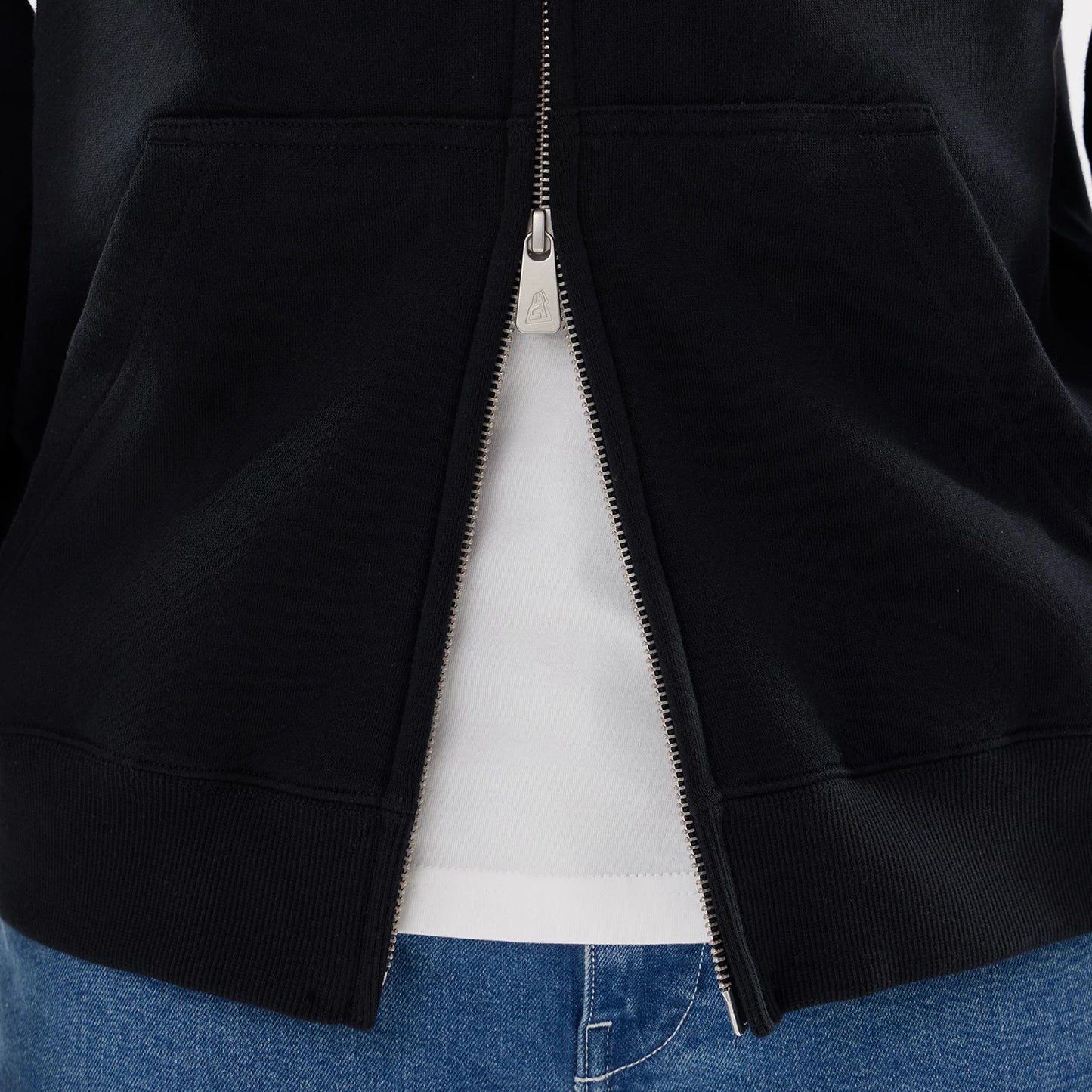 The model is wearing this MLB Word Art New York Yankees 2 Way Full Zip Hoodie in black. 6