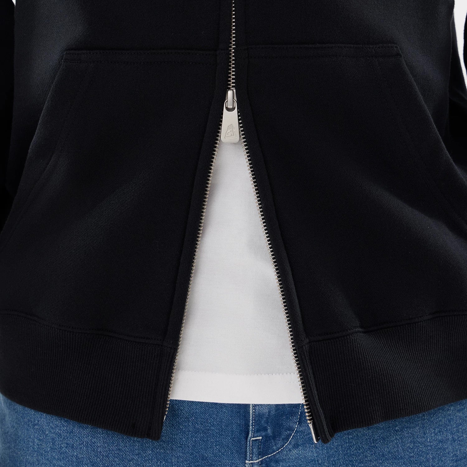 The model is wearing this MLB Word Art New York Yankees 2 Way Full Zip Hoodie in black. 6