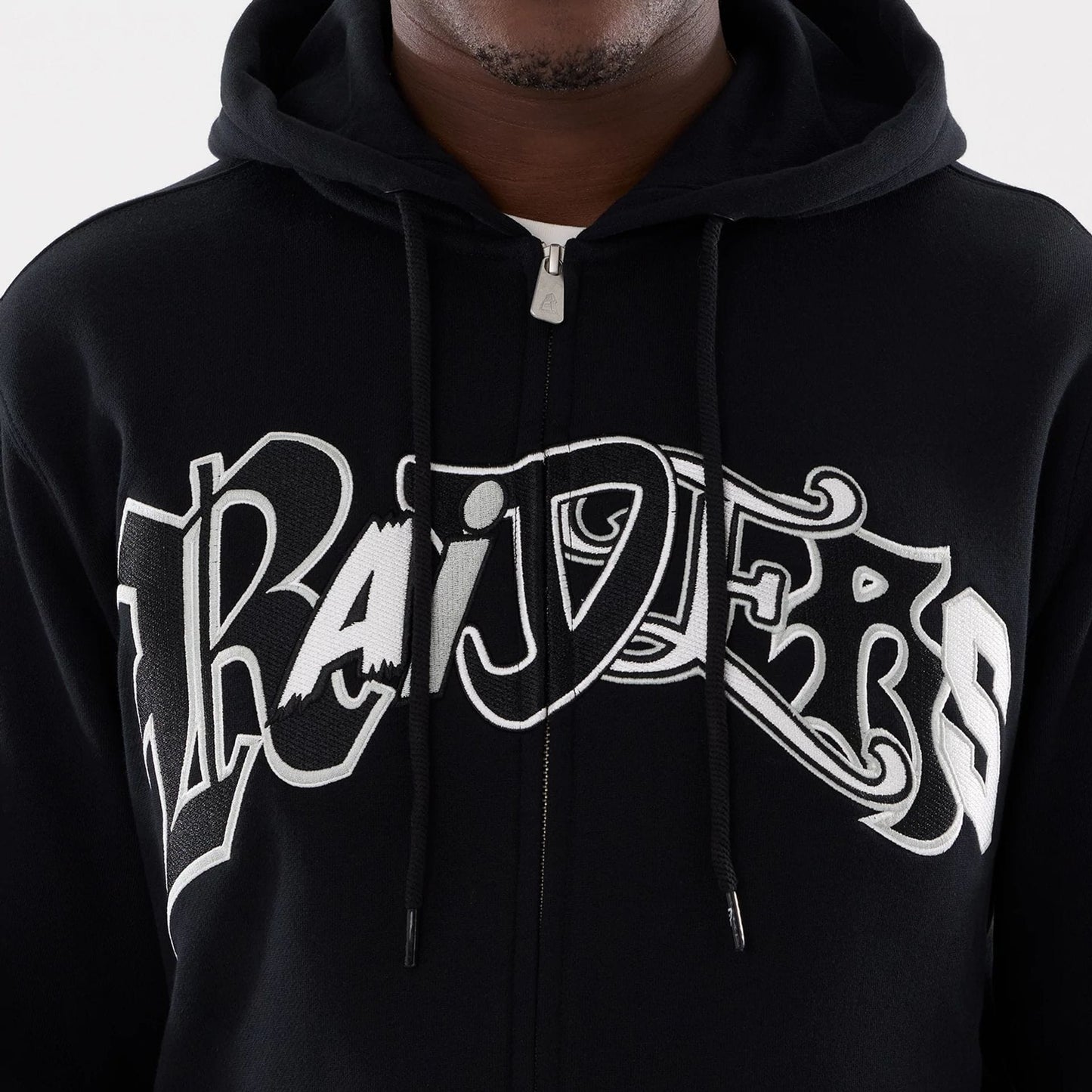 The model is wearing this MLB Word Art Las Vegas Raiders 2 Way Full Zip Hoodie in black. 4