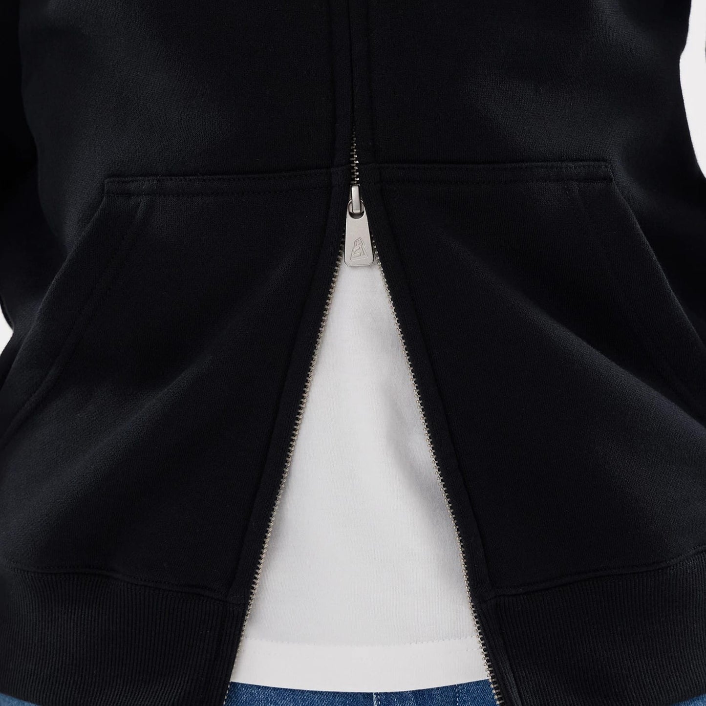 The model is wearing this MLB Word Art Las Vegas Raiders 2 Way Full Zip Hoodie in black. 6