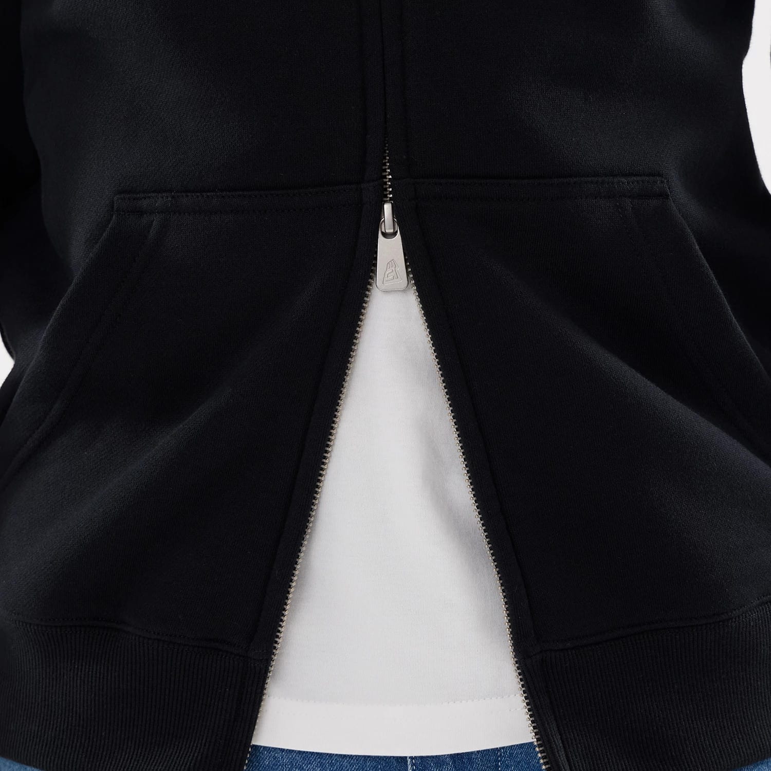 The model is wearing this MLB Word Art Las Vegas Raiders 2 Way Full Zip Hoodie in black. 6