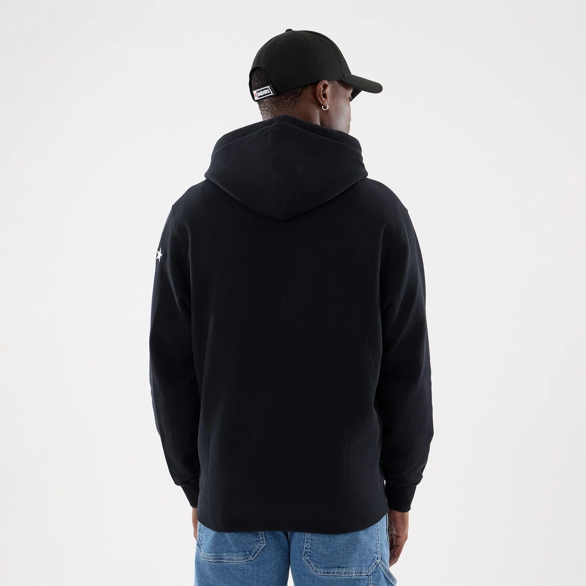 The model is wearing this MLB Word Art Las Vegas Raiders 2 Way Full Zip Hoodie in black. 2