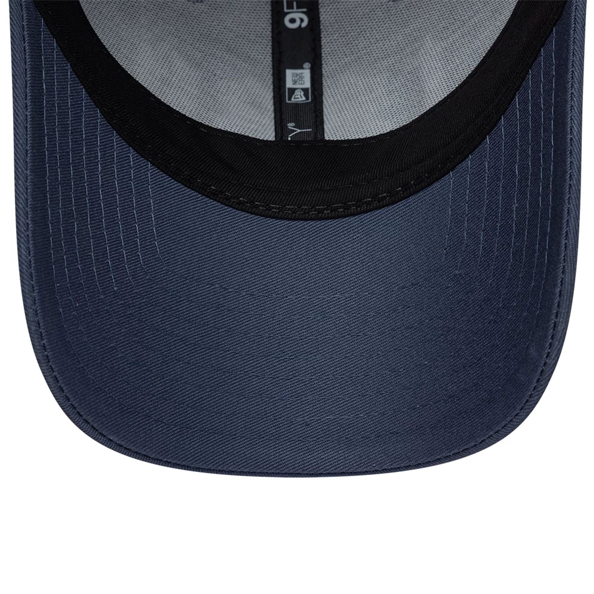 Pictured is this New Era Street Archived 9FORTY cap in dark blue. 7