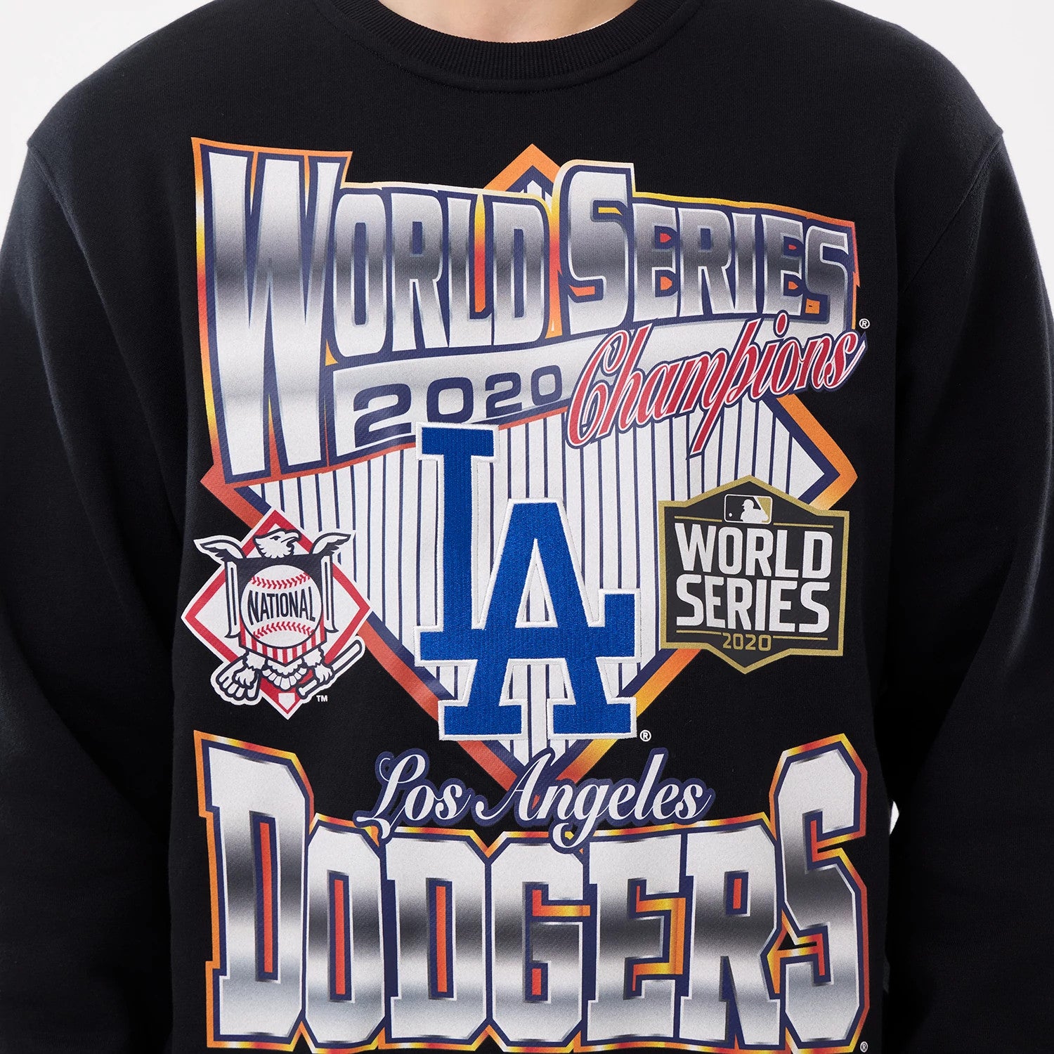The model is wearing this MLB Retro LA Dodgers Oversized Crew Neck Sweater in black. 5