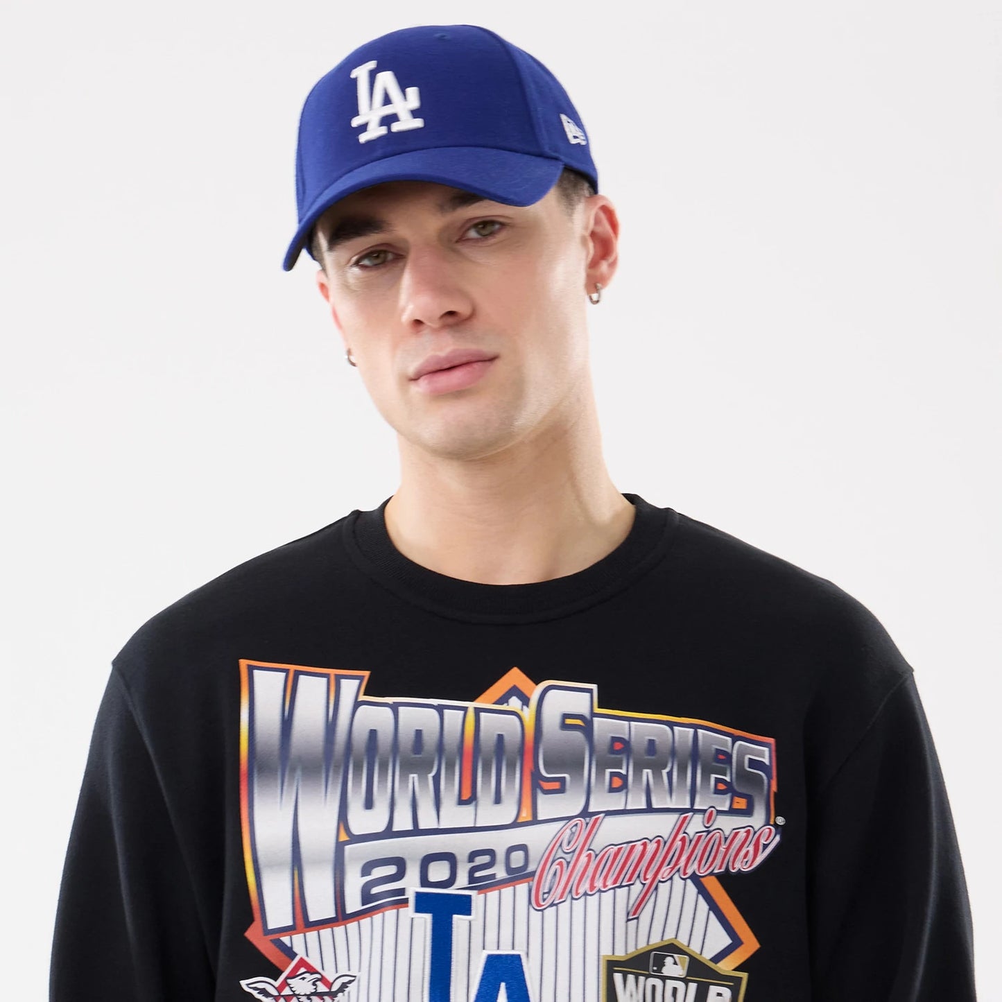 The model is wearing this MLB Retro LA Dodgers Oversized Crew Neck Sweater in black. 6