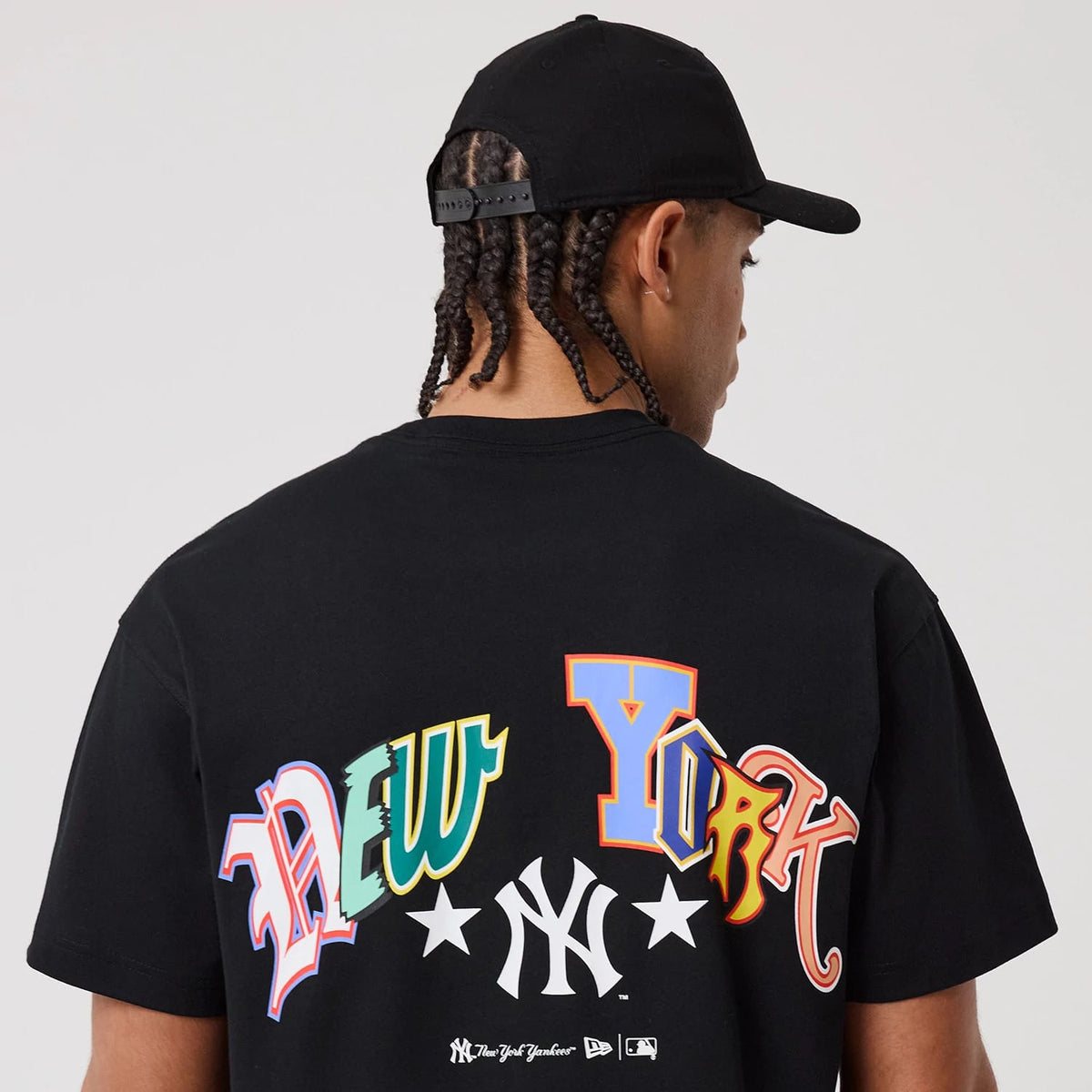 The model is wearing this MLB Word Art New York Yankees T-Shirt in black. 6