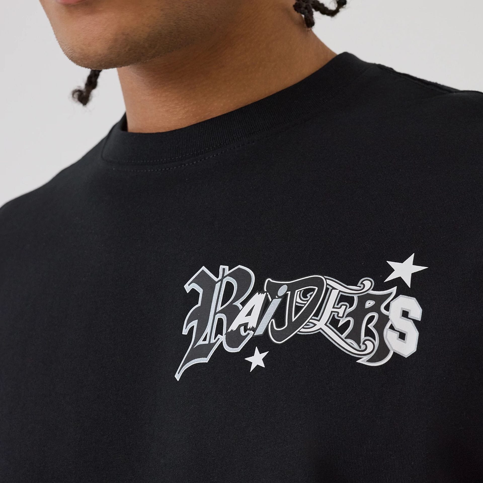 The model is wearing this NFL Word Art Las Vegas Raiders T-Shirt in black. 3