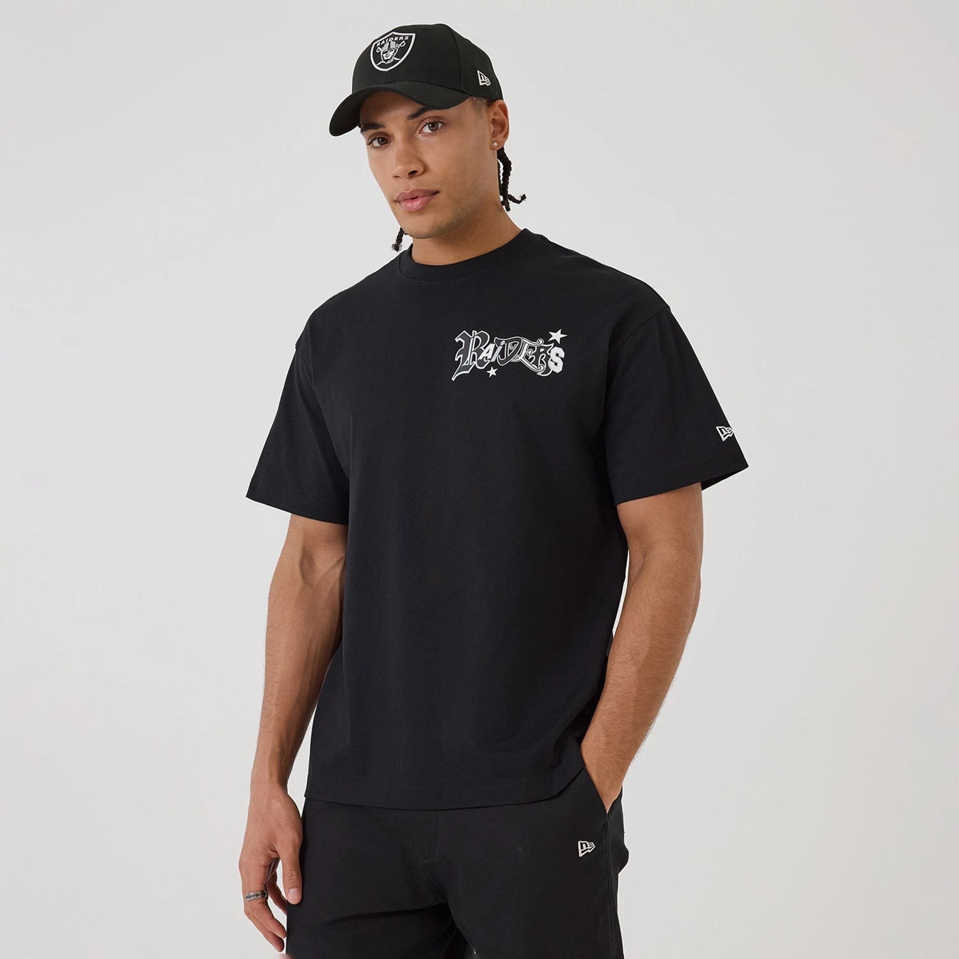 The model is wearing this NFL Word Art Las Vegas Raiders T-Shirt in black. 1