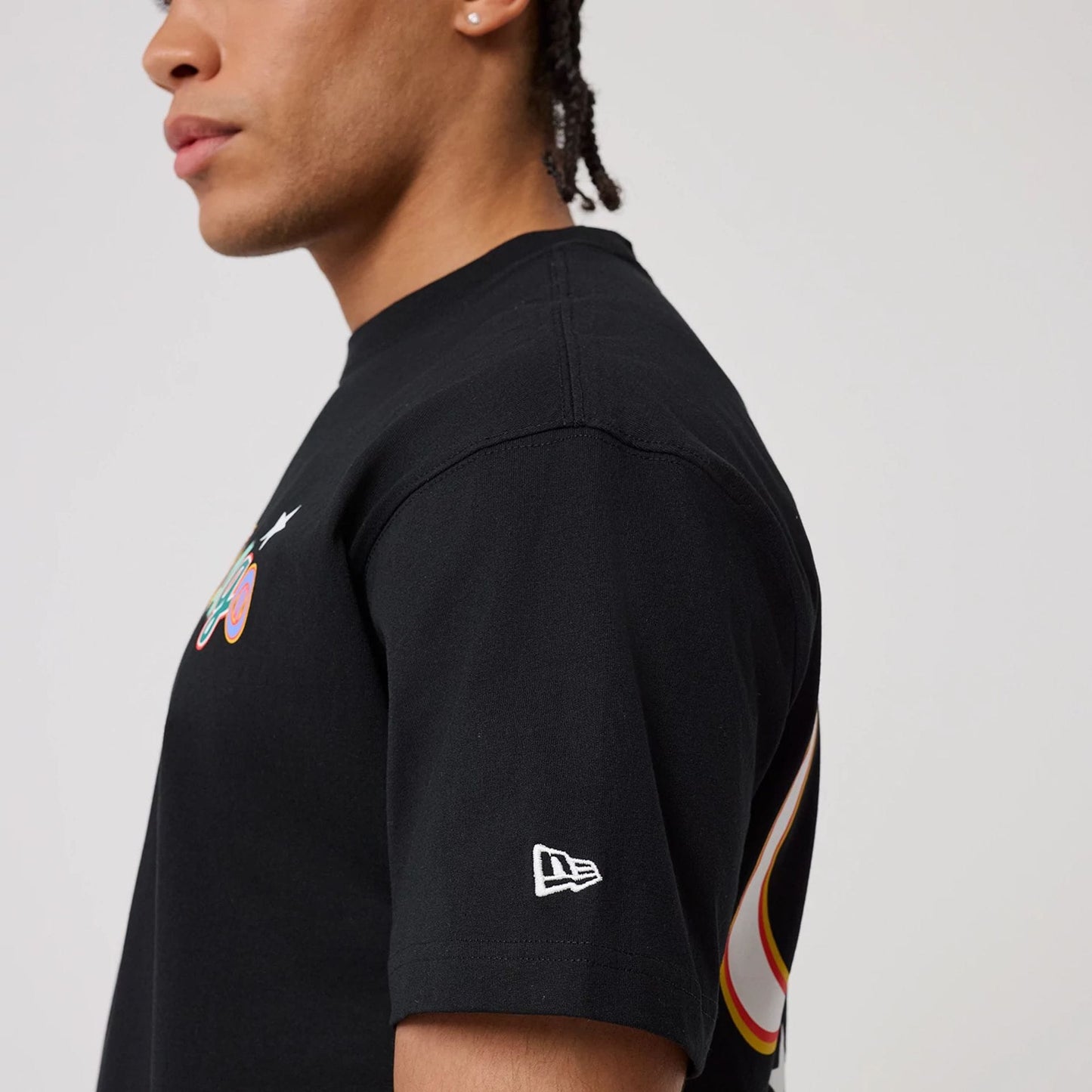 The model is wearing this MLB Word Art Chicago Bulls T-Shirt in black. 6