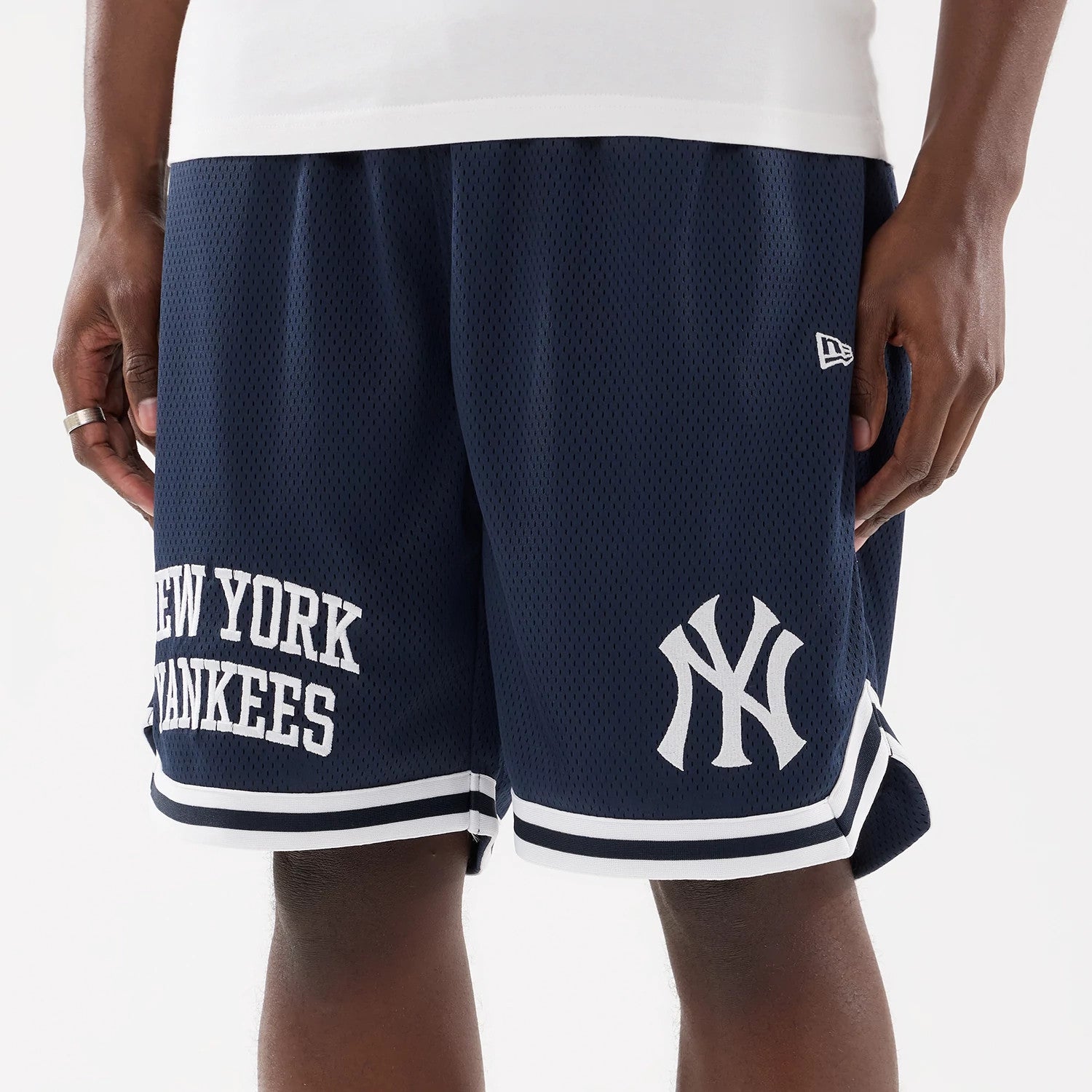 The model is wearing this MLB Comfort New York Yankees Oversized Shorts in navy. 3