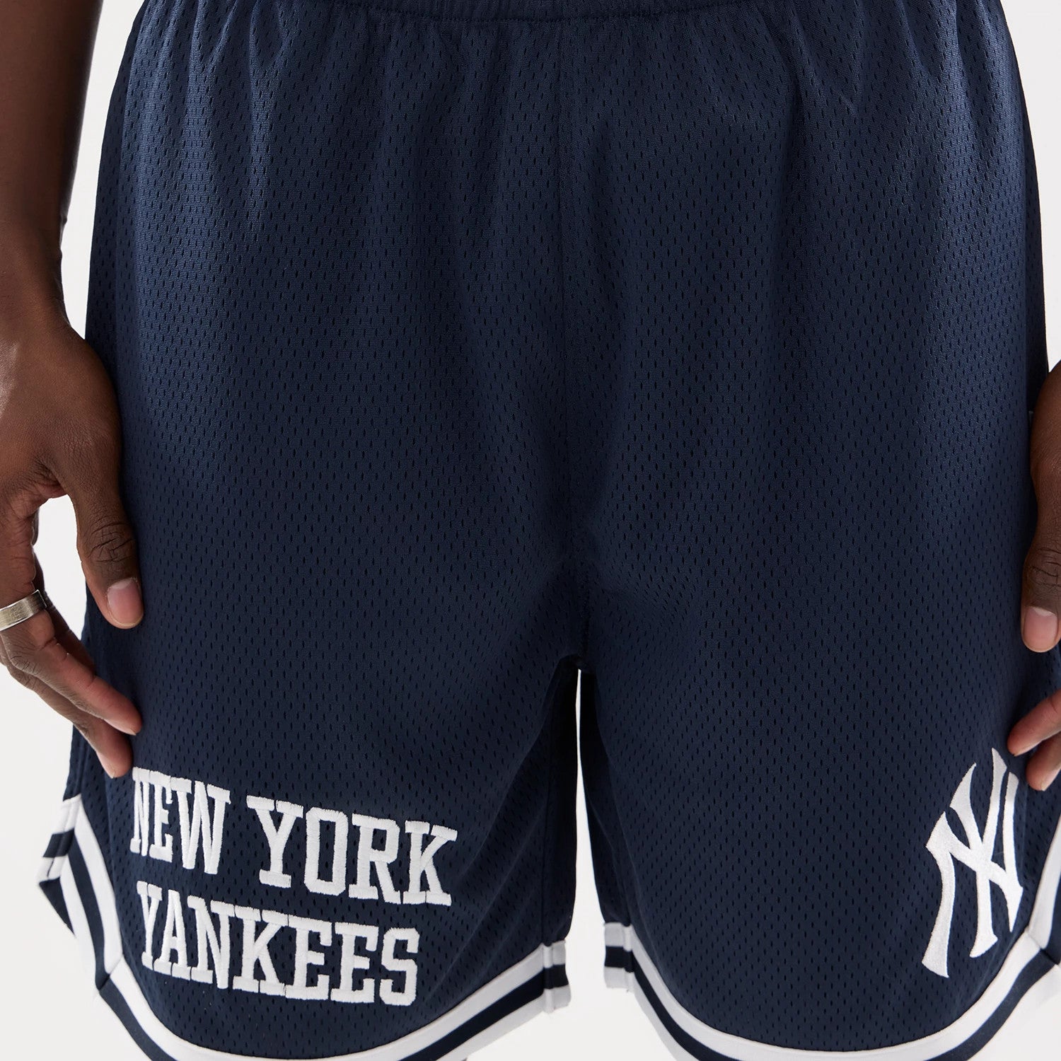 The model is wearing this MLB Comfort New York Yankees Oversized Shorts in navy. 4