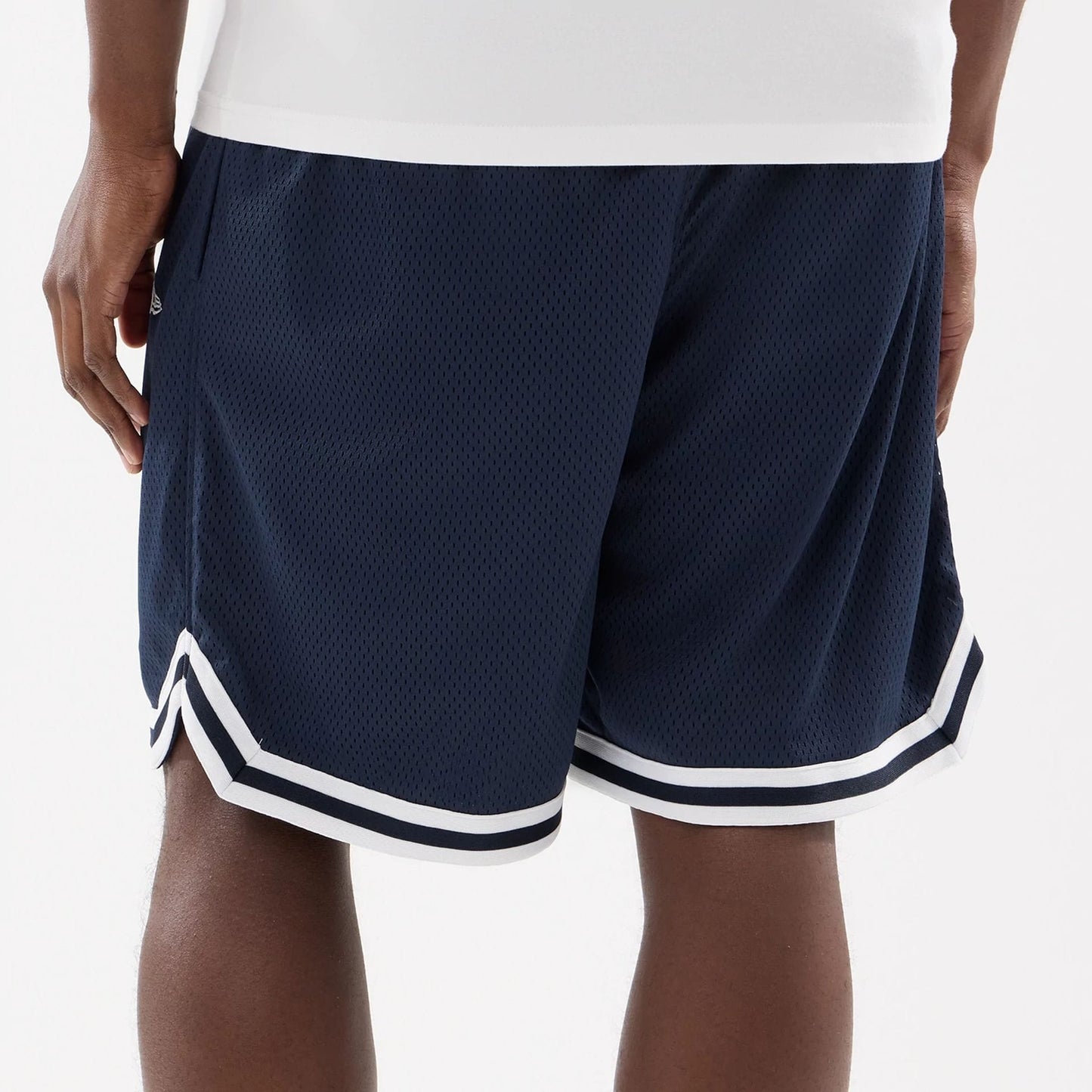 The model is wearing this MLB Comfort New York Yankees Oversized Shorts in navy. 6