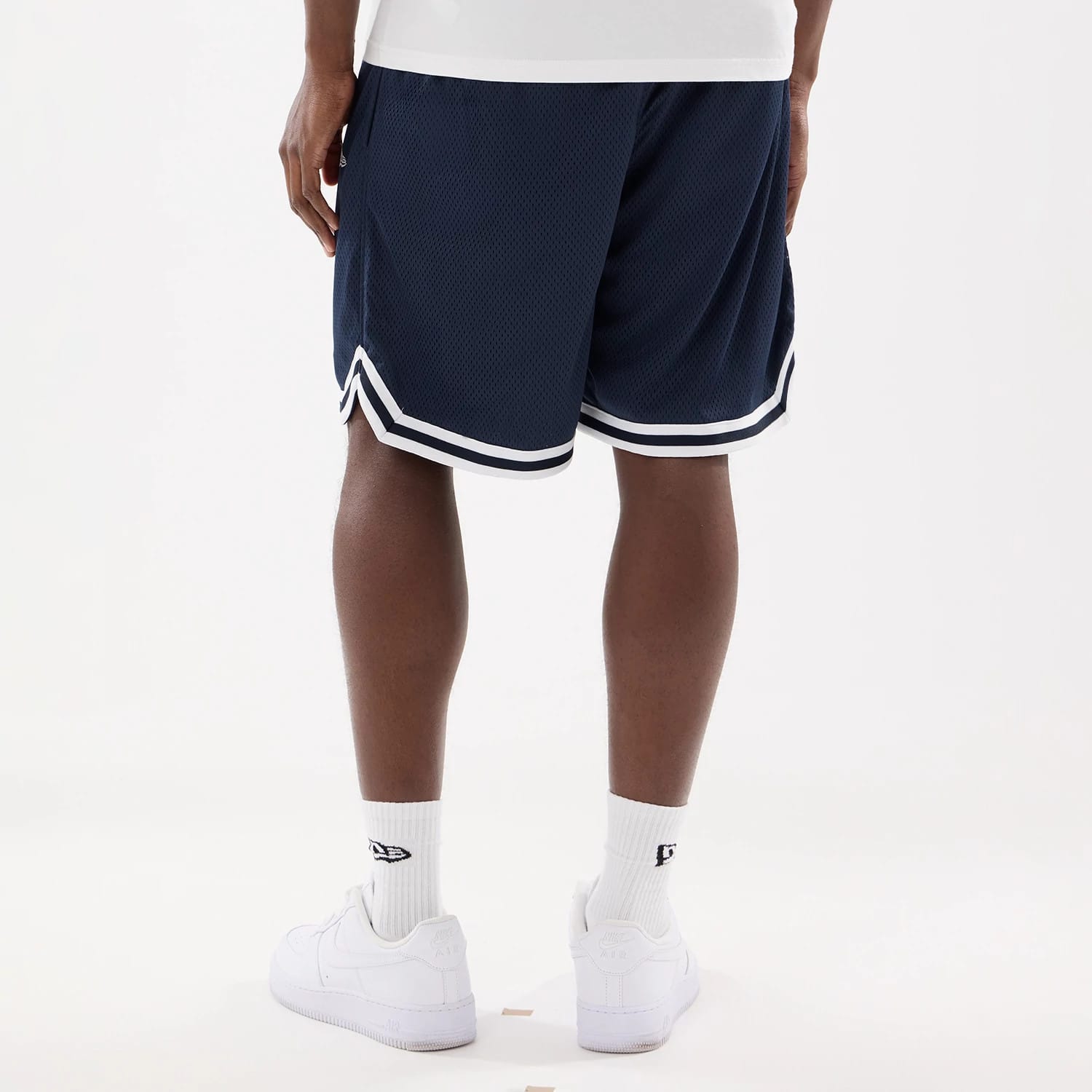 The model is wearing this MLB Comfort New York Yankees Oversized Shorts in navy. 2