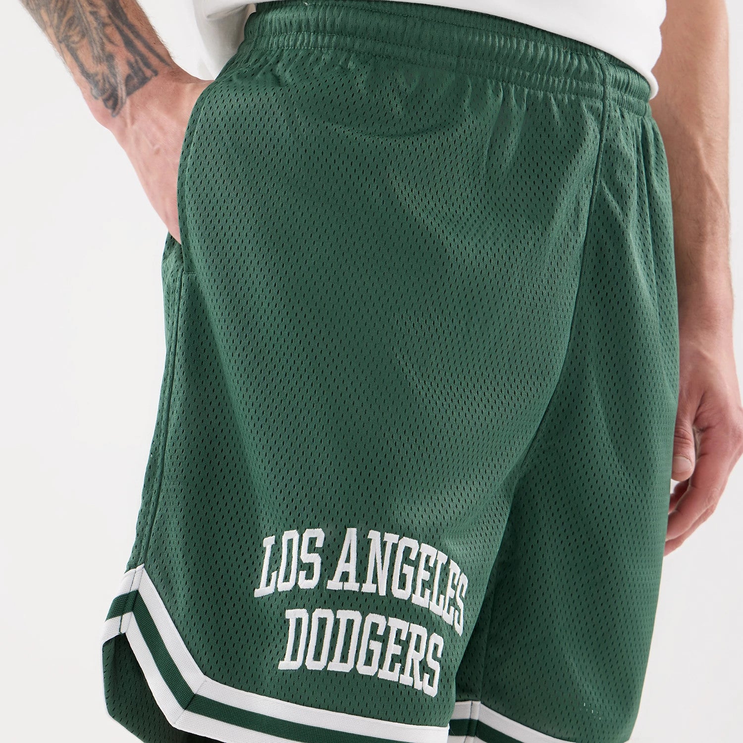 The model is wearing this MLB Comfort LA Dodgers Oversized Shorts in Dark Green. 4