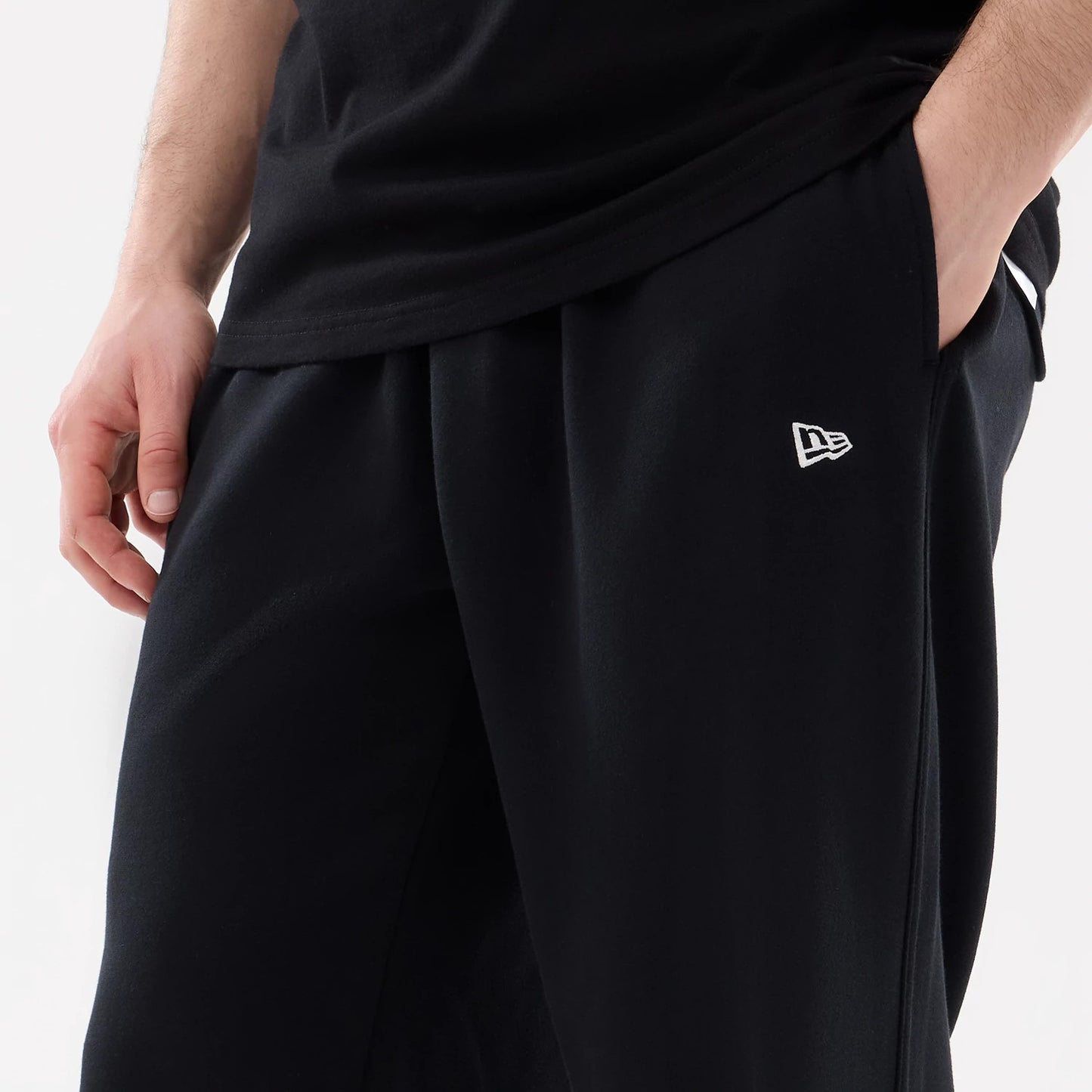 The model is wearing this New Era Straight Legged Joggers in black. 5