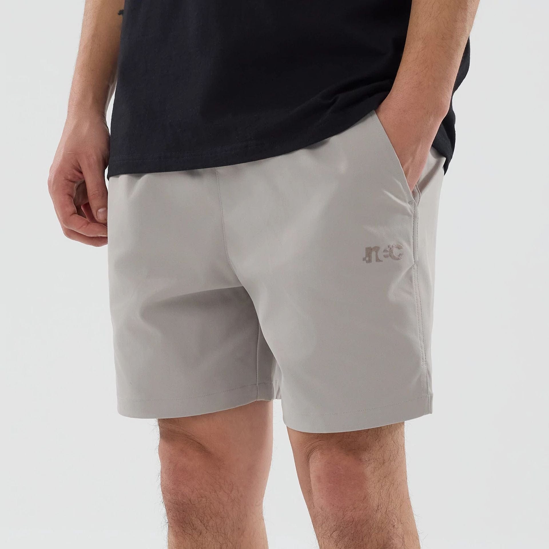 The model is wearing this New Era Urban Core Oversized Shorts in Beige . 3