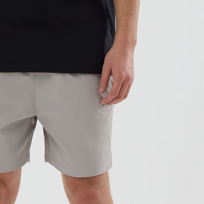 The model is wearing this New Era NEC Logo Oversized Shorts in Beige . 5