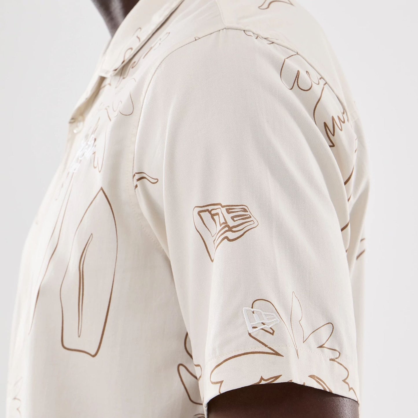 The model is wearing this New Era Resort Short Sleeve Shirt in natural. 4