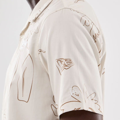 The model is wearing this New Era Resort Short Sleeve Shirt in natural. 4