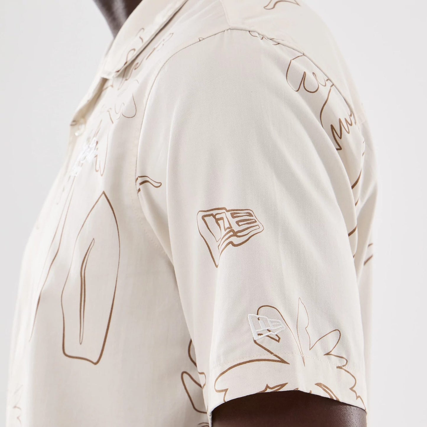 The model is wearing this New Era Resort Short Sleeve Shirt in natural. 4