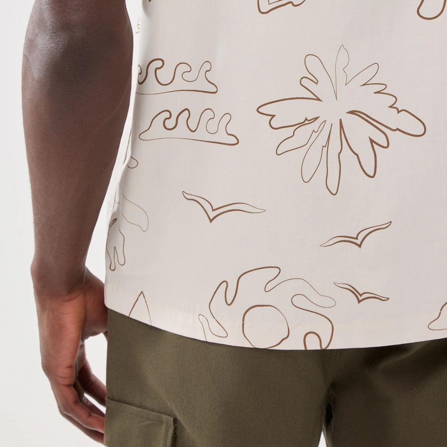 The model is wearing this New Era Resort Short Sleeve Shirt in natural. 5