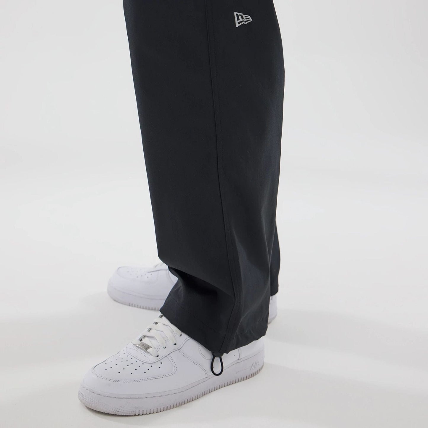 The model is wearing this New Era Urban Core Straight Leg Joggers in black. 5