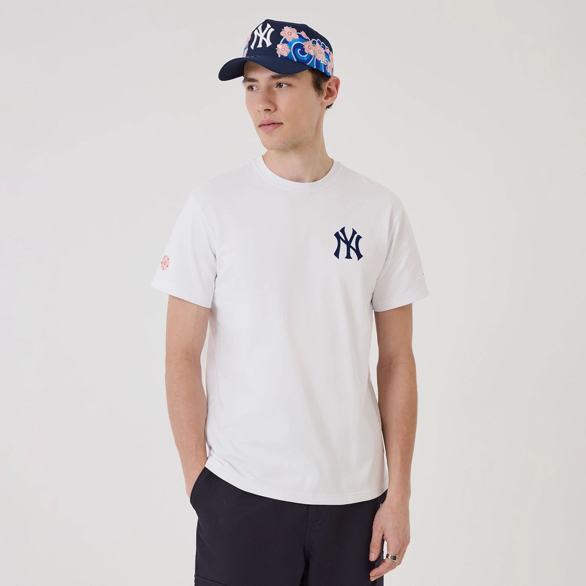 The model is wearing this MLB Sakura New York Yankees T-Shirt in white. 1