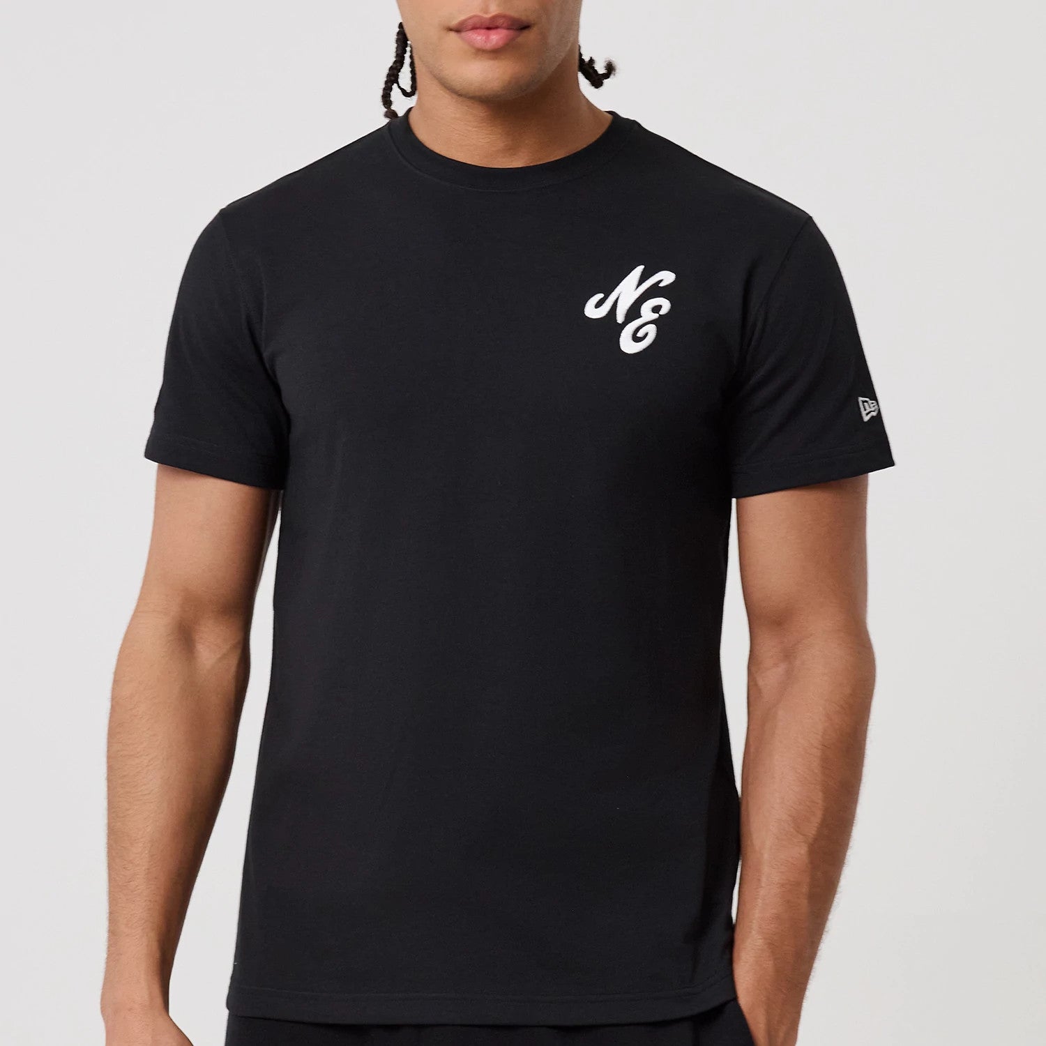 The model is wearing this New Era Sakura T-Shirt in black. 4