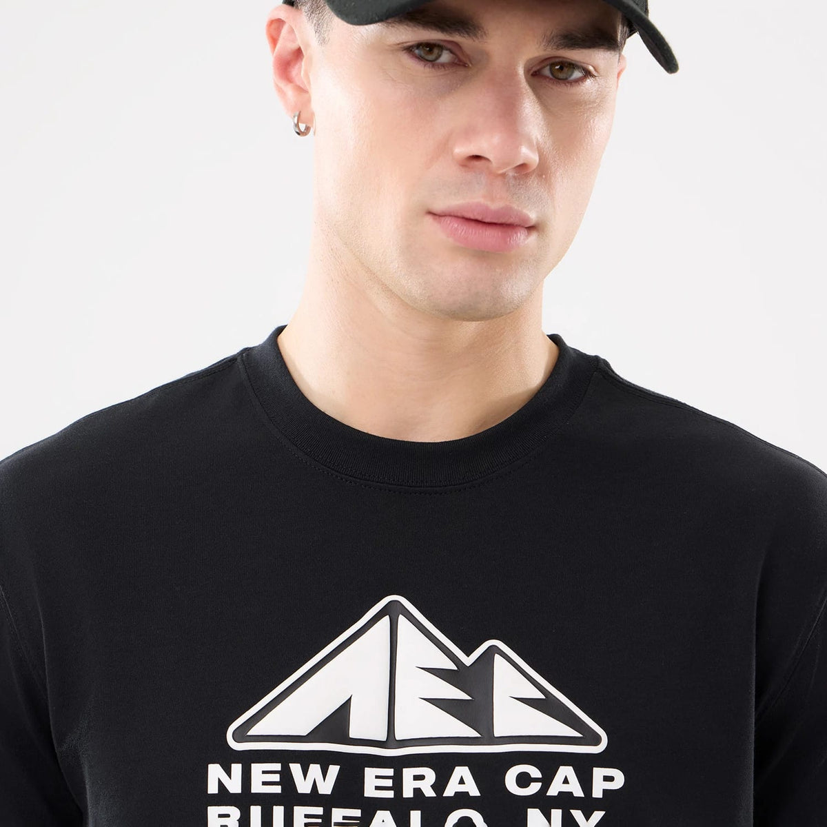 The model is wearing this New Era Outdoor Mountain T-Shirt in black. 5