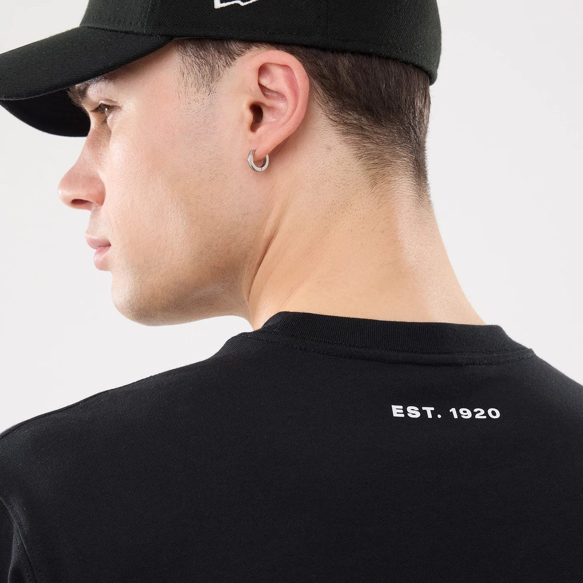 The model is wearing this New Era Outdoor Mountain T-Shirt in black. 6