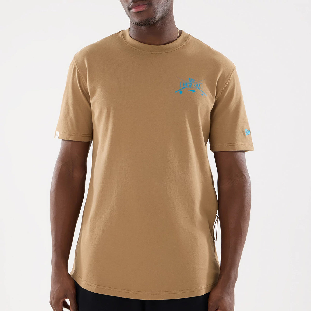 The model is wearing this New Era Outdoor Fishing T-Shirt in Beige. 5
