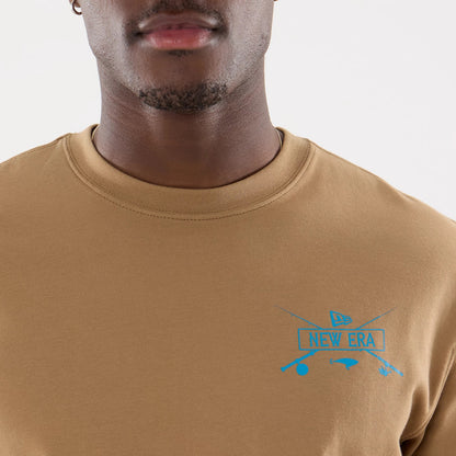 The model is wearing this New Era Outdoor Fishing T-Shirt in Beige. 6
