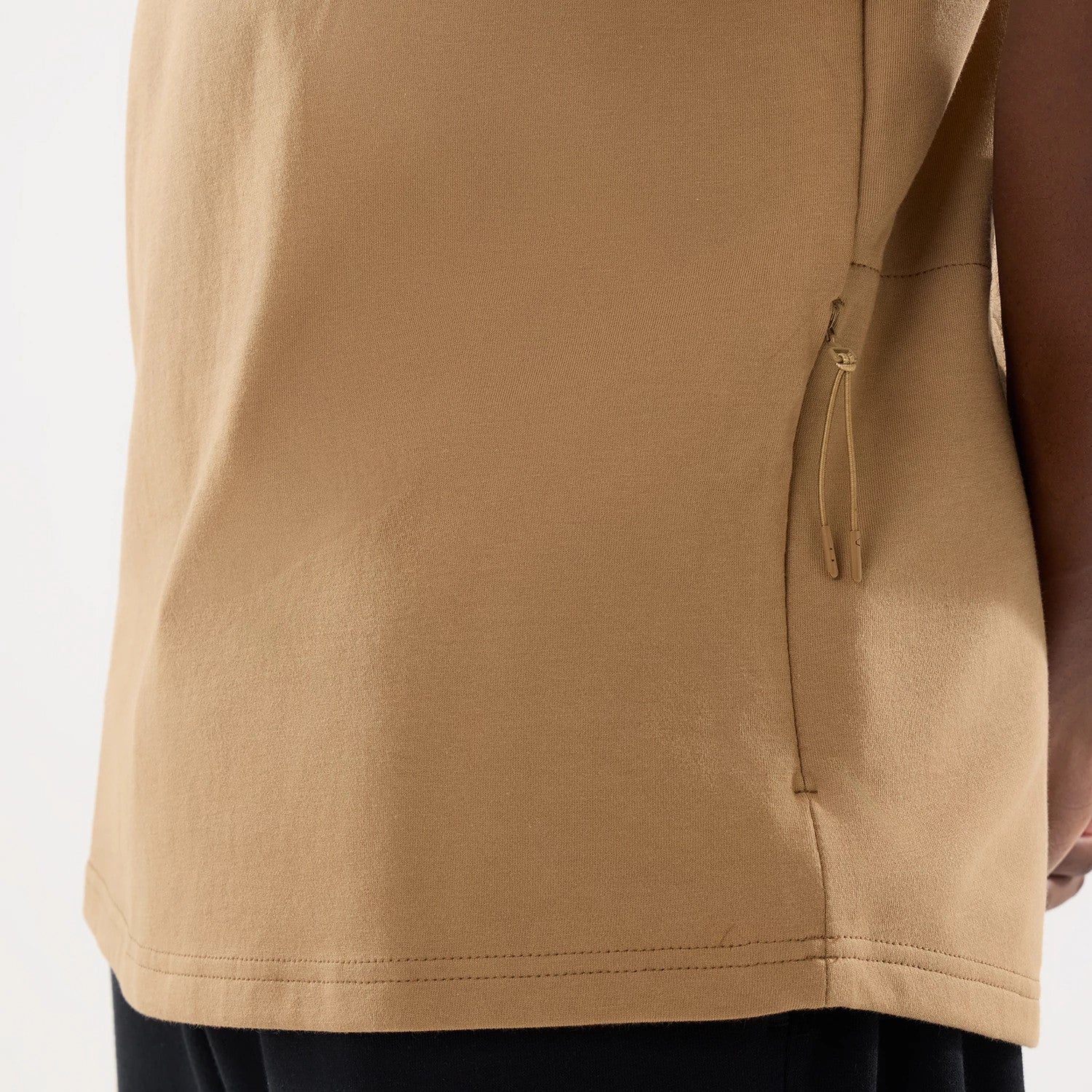 The model is wearing this New Era Outdoor Fishing T-Shirt in Beige. 7