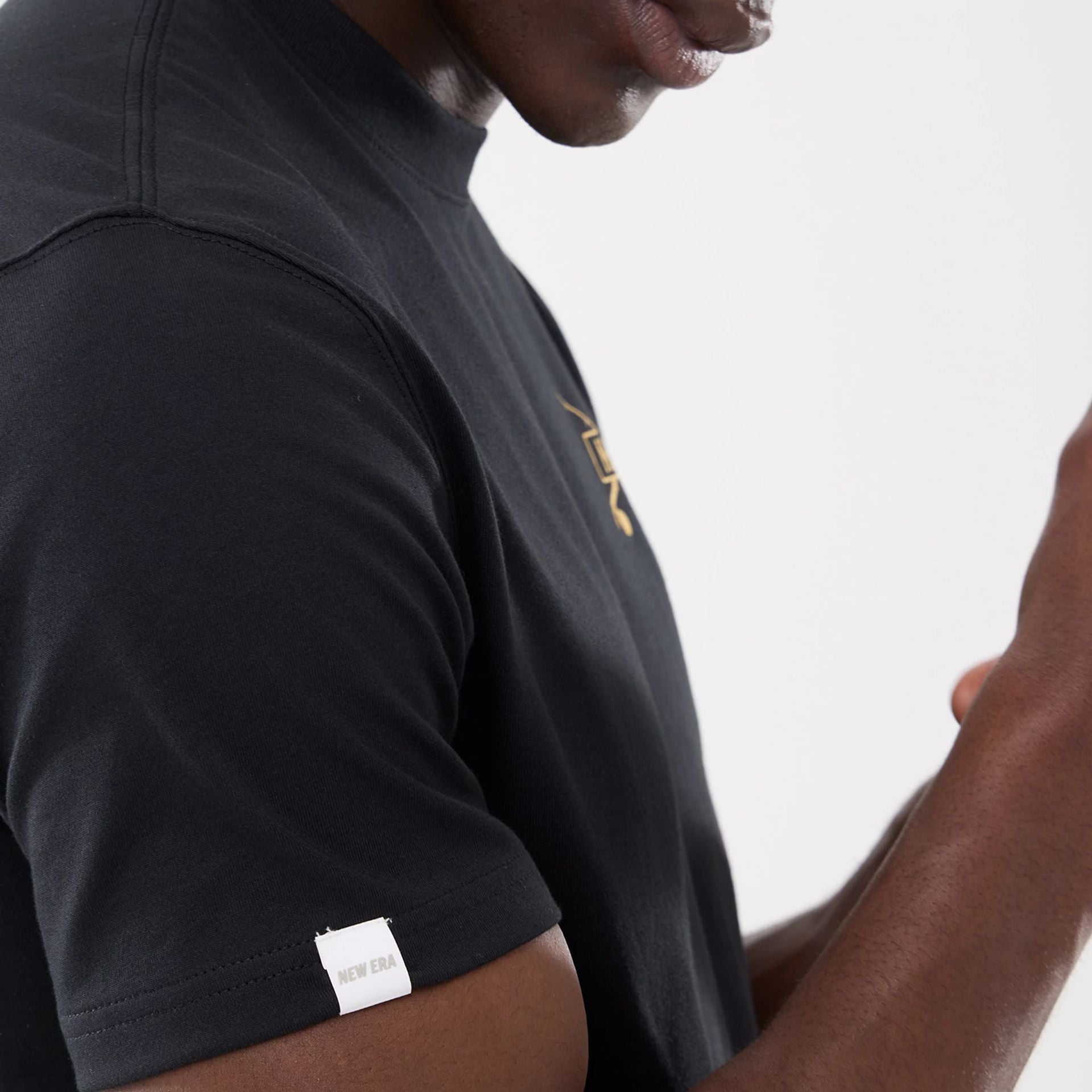 The model is wearing this New Era Outdoor Fishing T-Shirt in black. 5