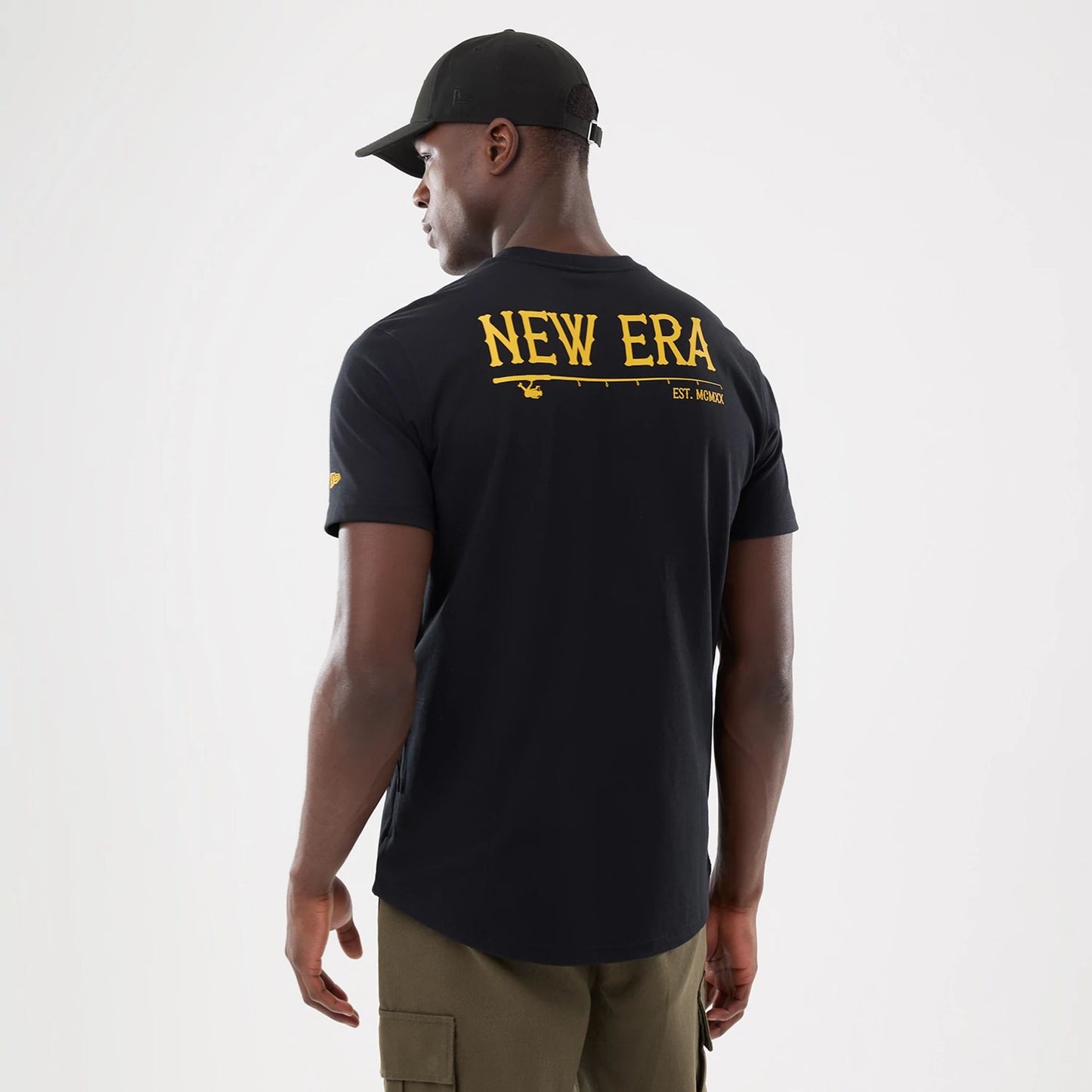 The model is wearing this New Era Outdoor Fishing T-Shirt in black. 2