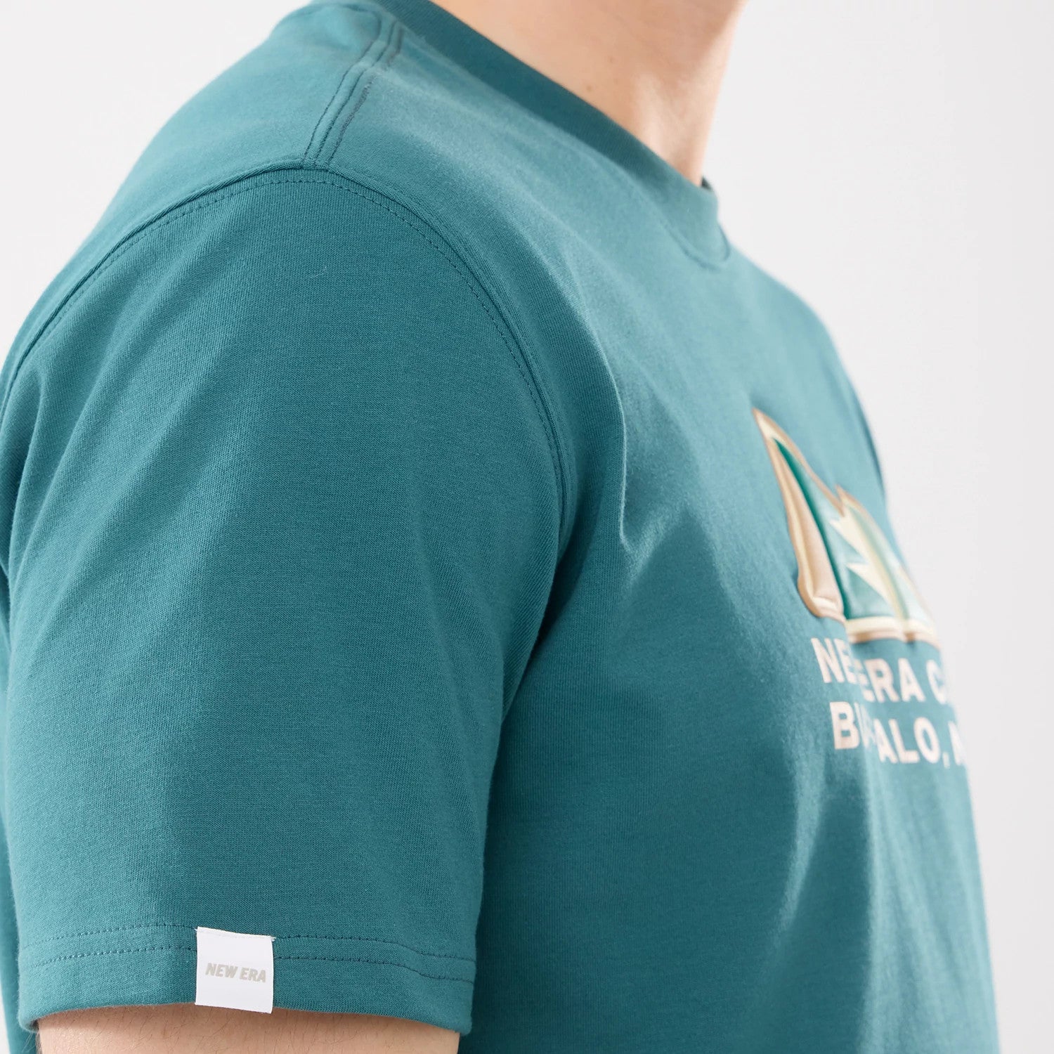 The model is wearing this New Era Outdoor Mountain T-Shirt in dark green. 4