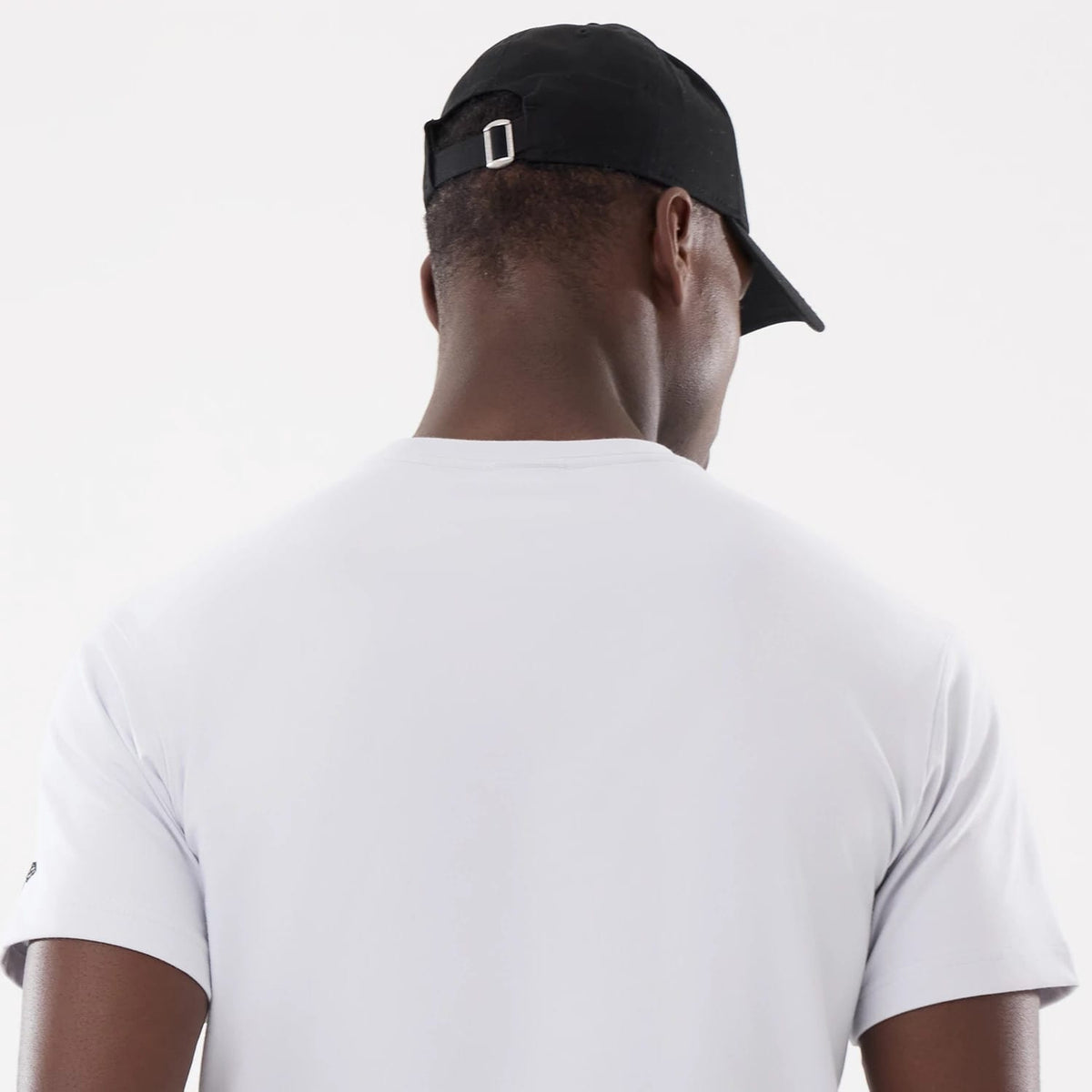 The model is wearing this New Era Basic T-Shirt in white. 7