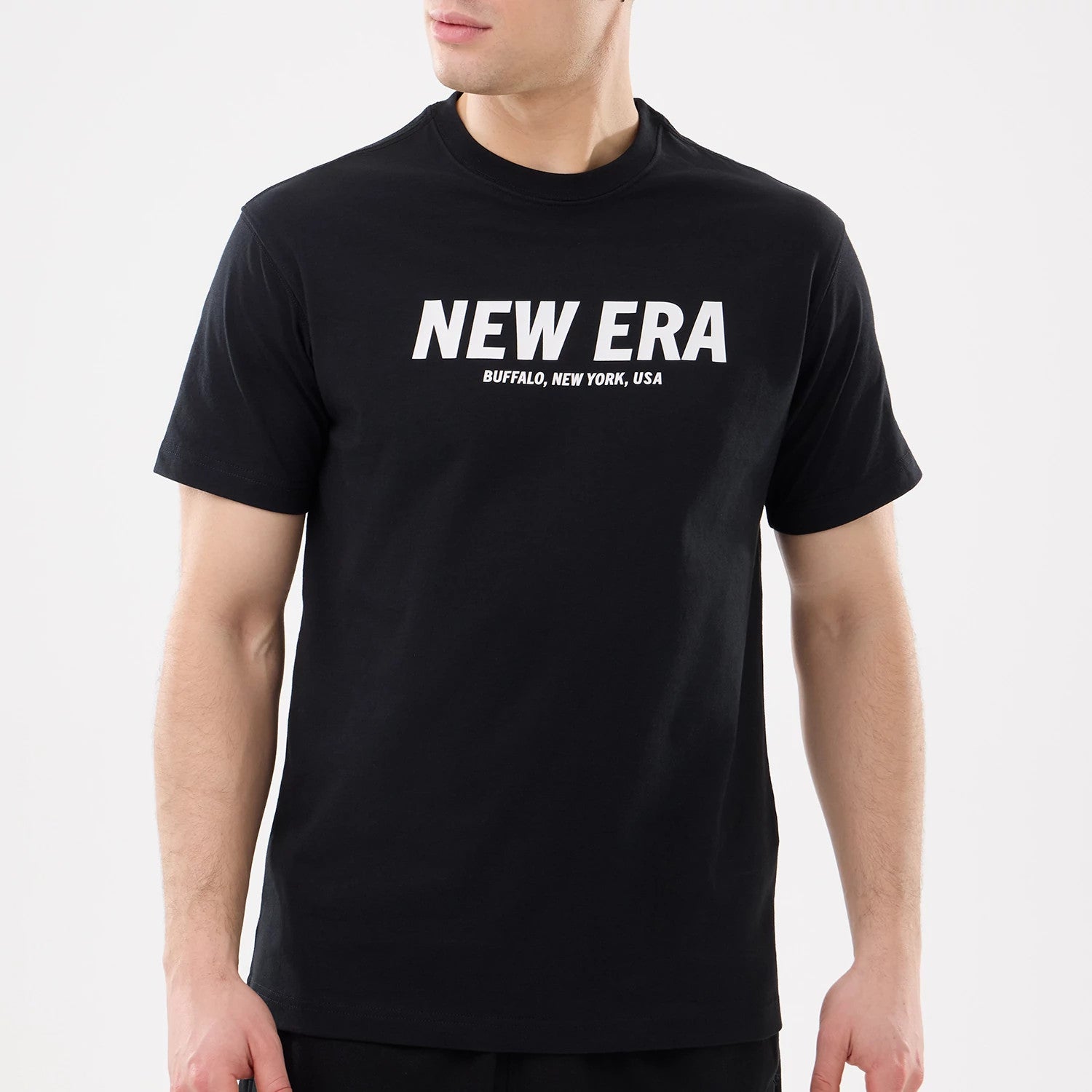 The model is wearing this New Era Basic T-Shirt in black. 3