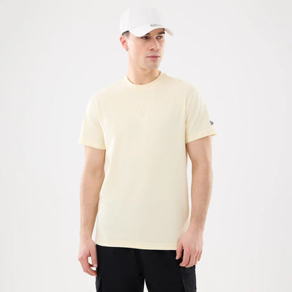 The model is wearing this MLB Cartoon New York Yankees T-Shirt in cream. 1