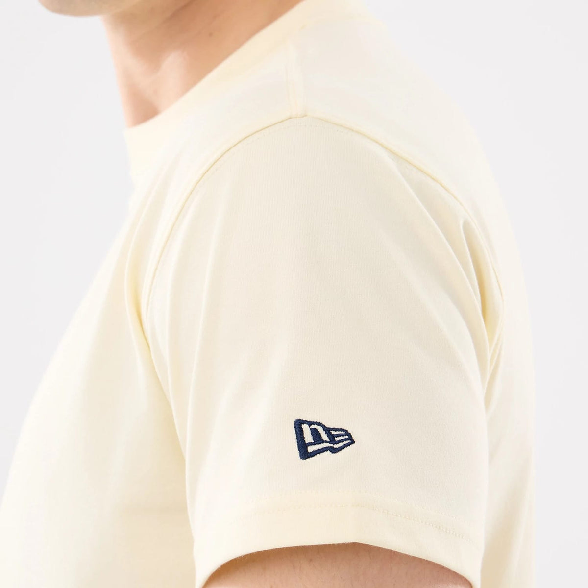 The model is wearing this MLB Cartoon New York Yankees T-Shirt in cream. 5