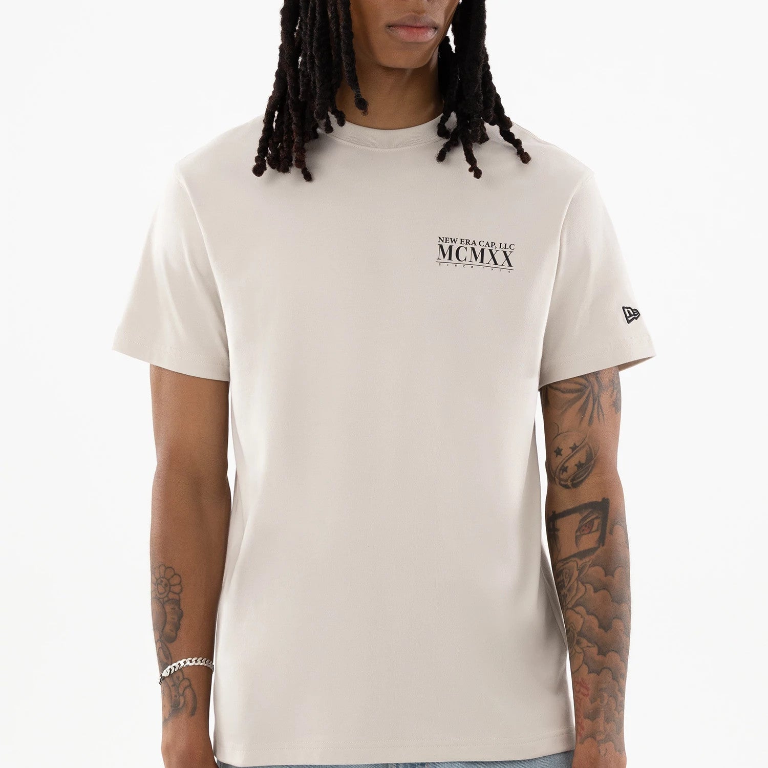 The model is wearing this New Era Heritage T-Shirt in Cream. 4