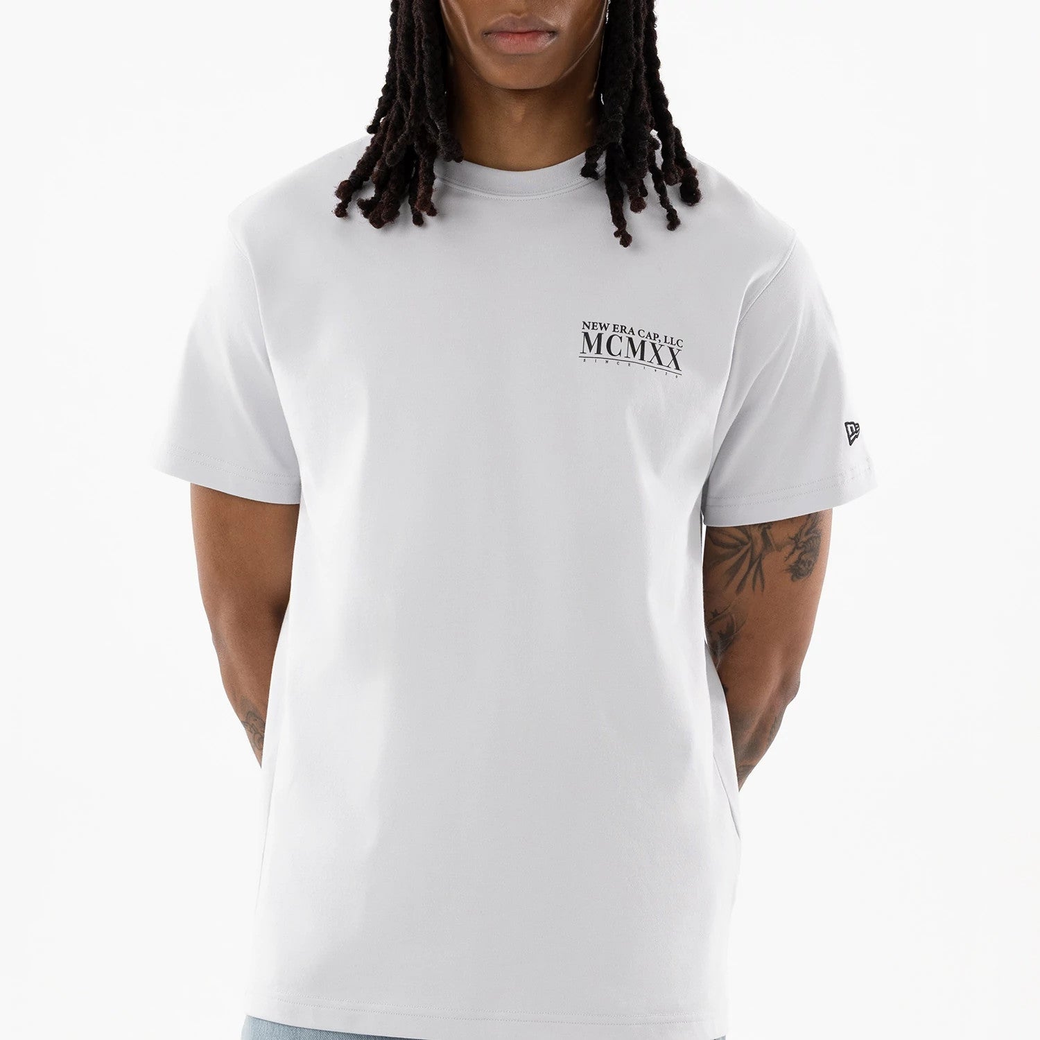 The model is wearing this New Era Heritage T-Shirt in White. 3